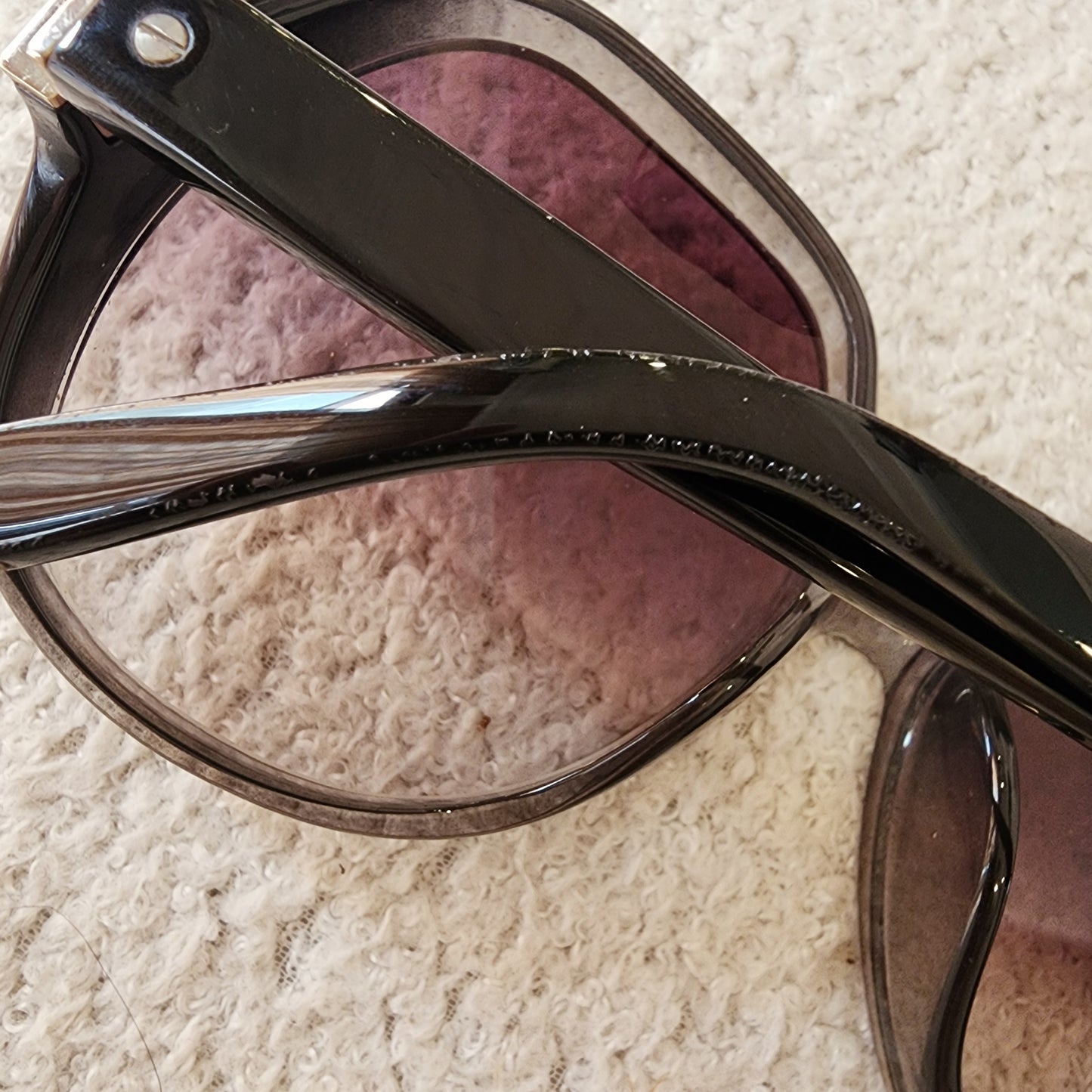 Close-up view pf the temple on the Chloe oversized sunglasses showing the crackling of the outer coating.