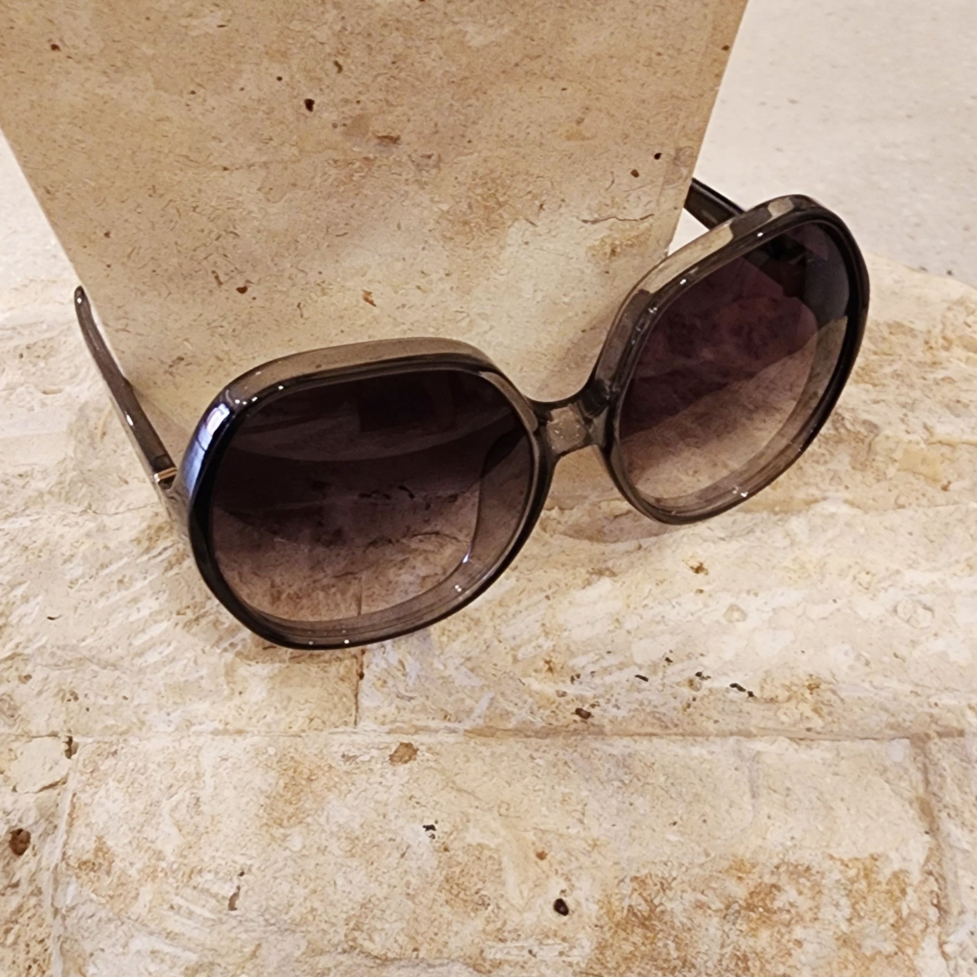 Top view of the Chloe oversized sunglasses, showing the smokey coloured frame and gradient lens.