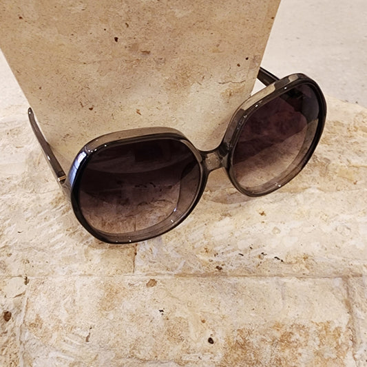 Top view of the Chloe oversized sunglasses, showing the smokey coloured frame and gradient lens.