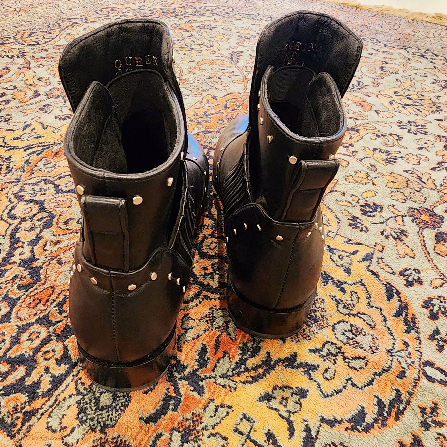 Back view of the Queen The Label studded boots showing the ankle pull detail and the soft leather.