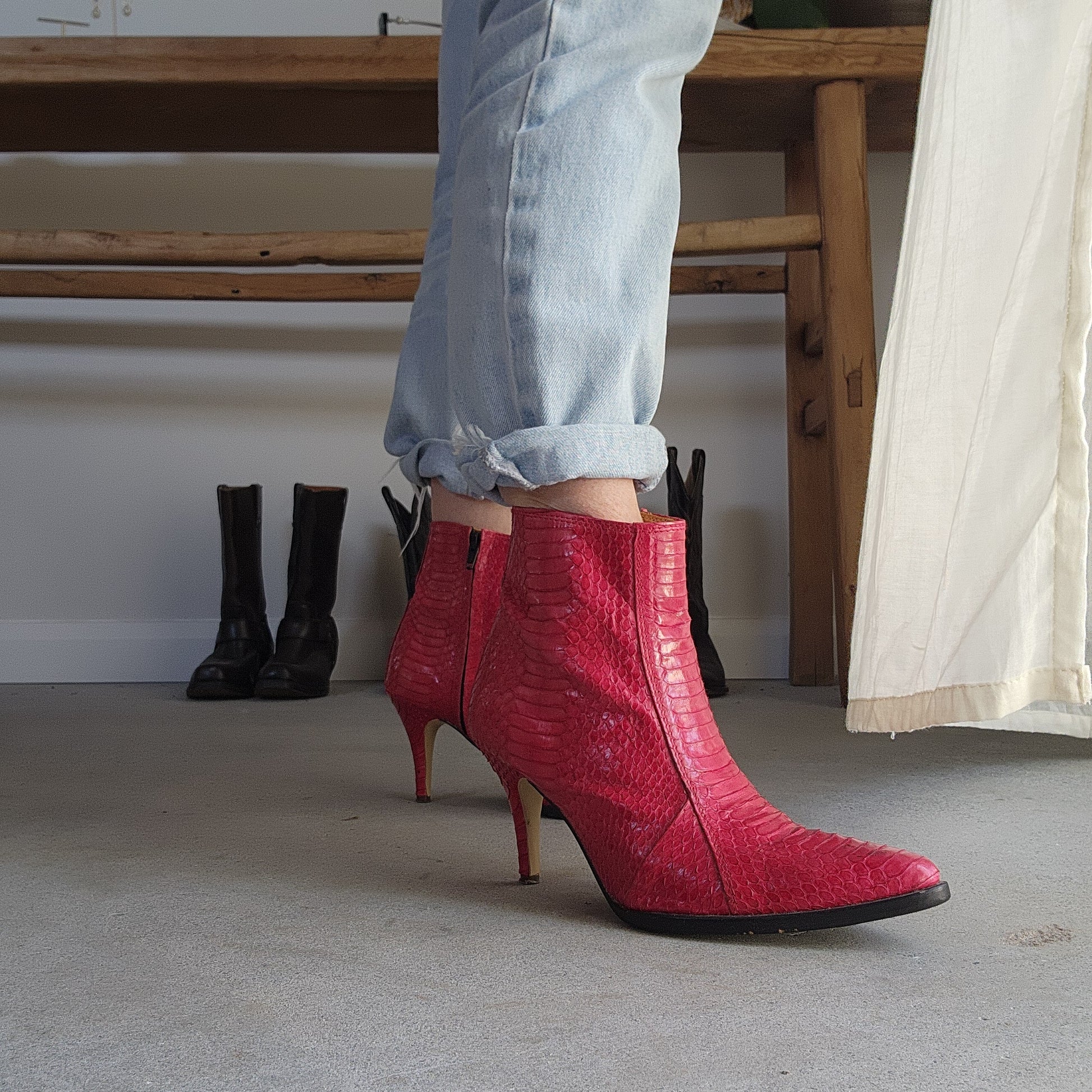 Wonderful worn red snakeskin boots. Western ankle stiletto heel boots