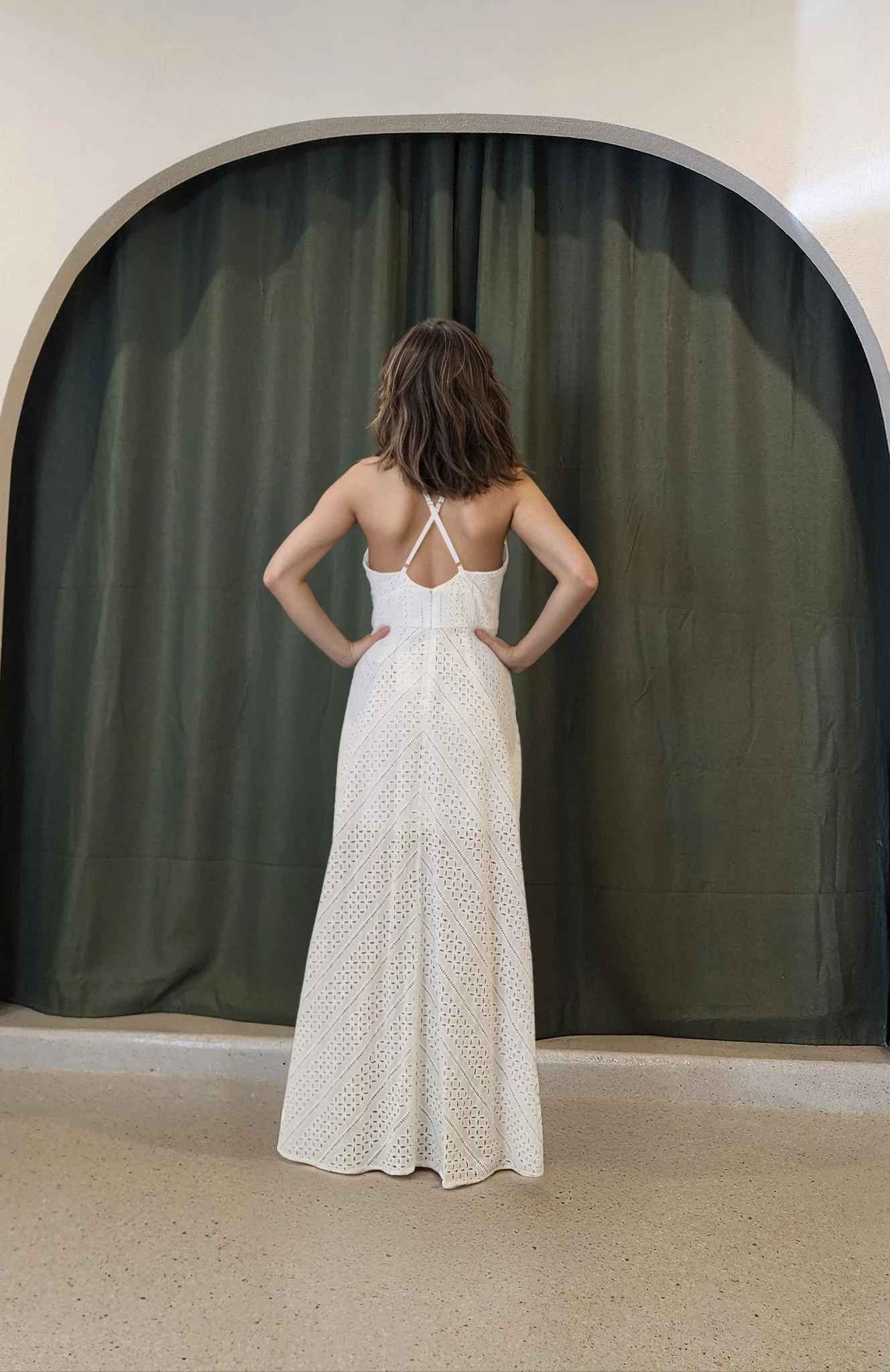 Rear view of the Sheike Arabesque Maxi Dress highlighting the cross-back strap detail and soft chevron lace pattern.