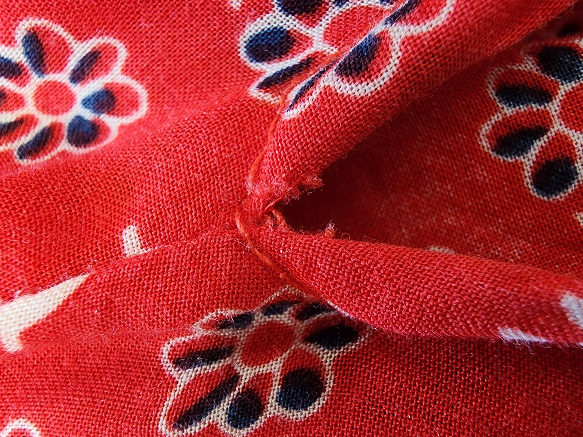 Close up of small rip at top of split on the spell gypsiana maxi skirt