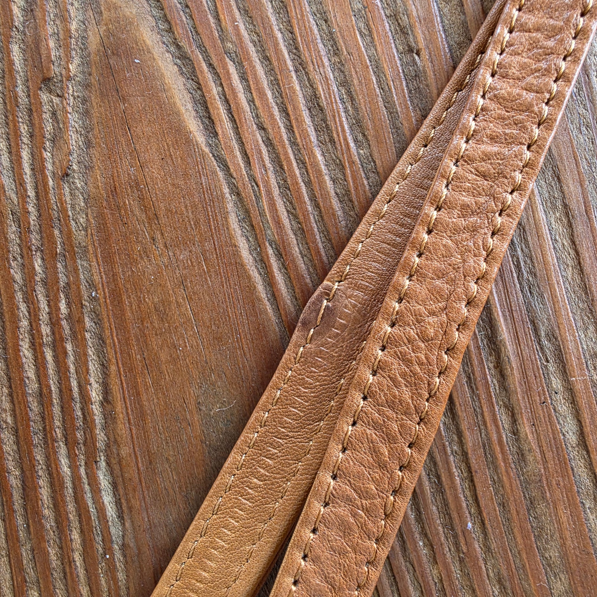 Close-up of markings on tan leather Wanderers wallet