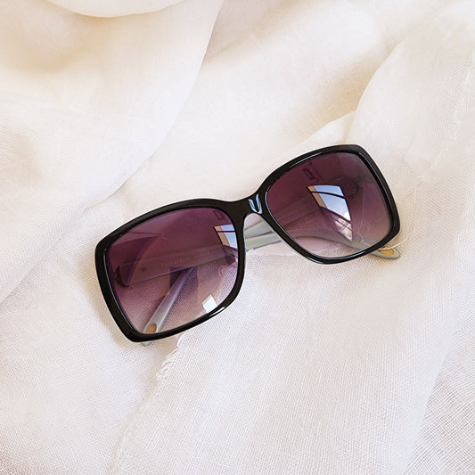 Close up of front of Authentic Tiffany & Co. sunglasses showing the gradient lens and rectangle shape.