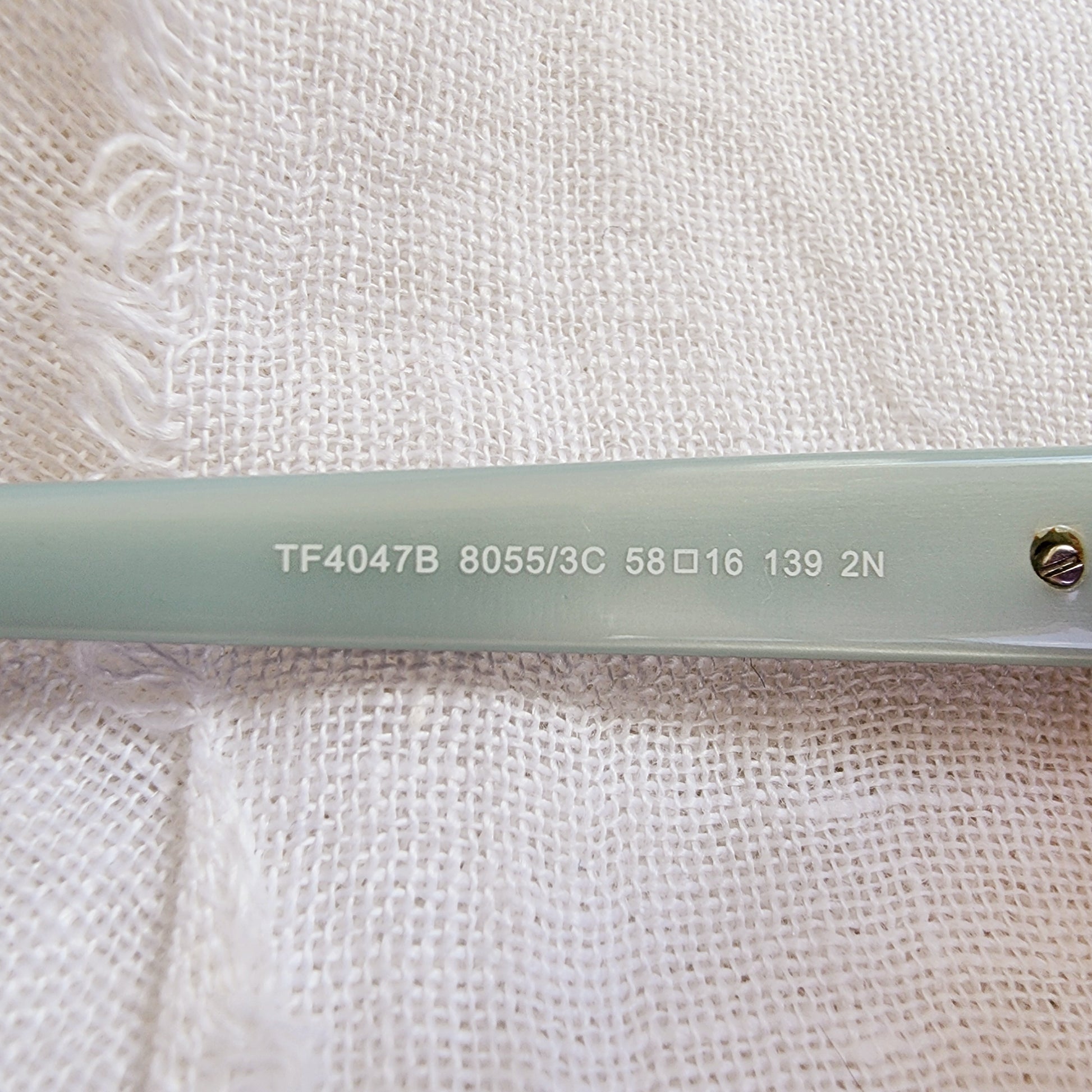 Close up of the Tiffany & Co. product code and style number on the left temple.