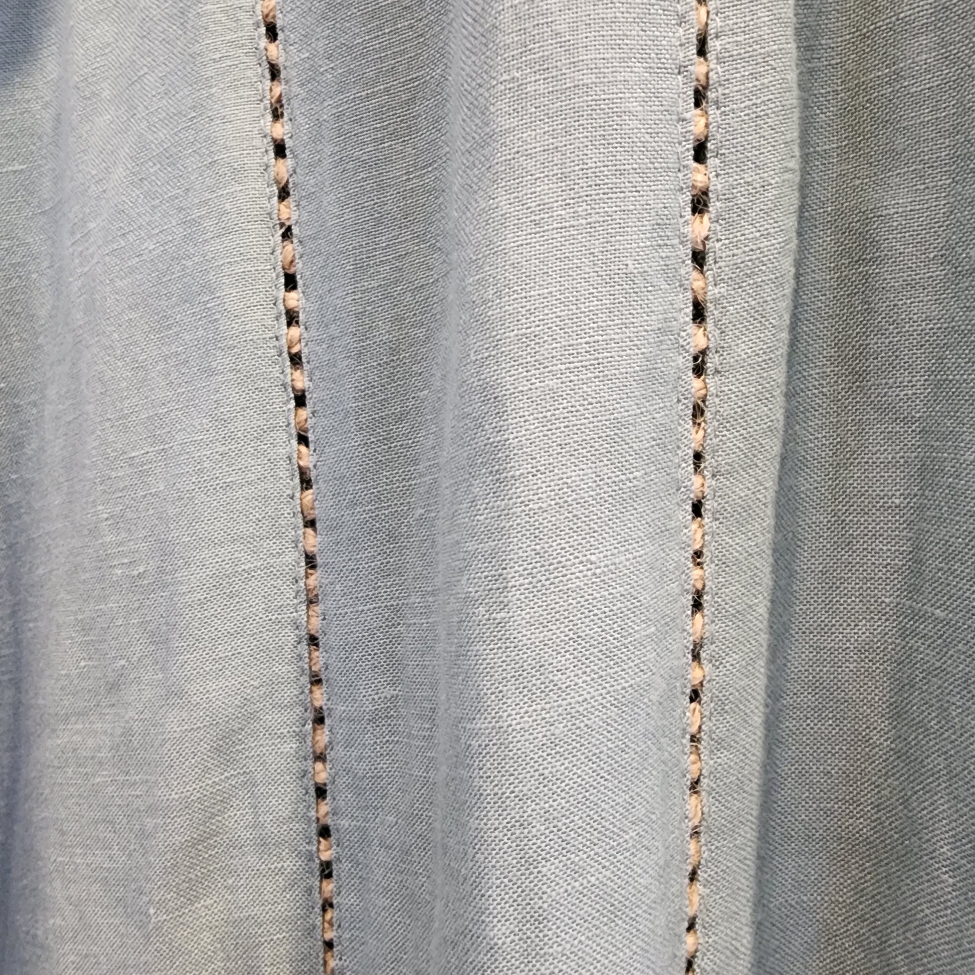 Close up of the Tigerlily Hana jumpsuit leg details.