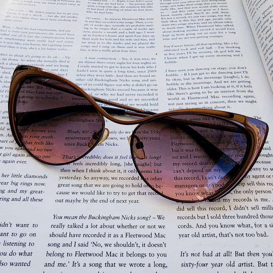 Close-up view of the front of Tom Ford Natasya sunglasses, in rose bronze with a pink gradient lens.