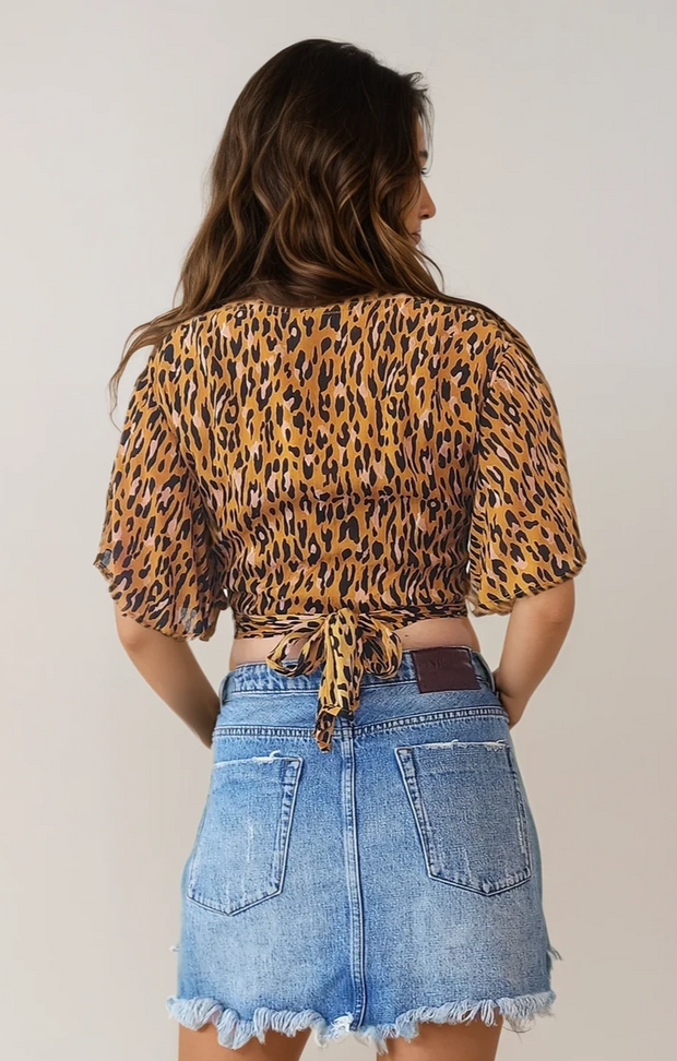 Leopard print Tree of Life wrap top in size small. Wonderful worn condition. Like new available at Wilson Avenue 