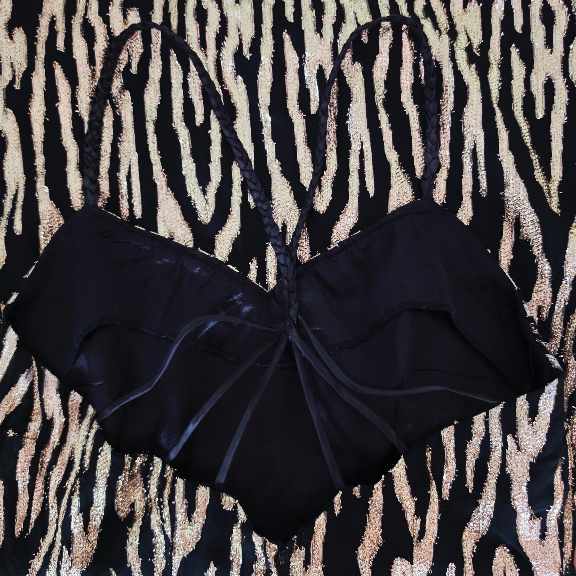 Close up of the braided straps and themetallic fabric on the Vintage Zebra Metallic Mini Dress