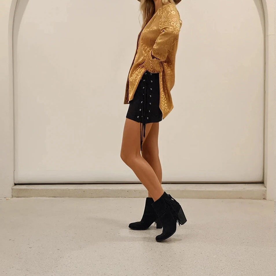 Side view of the ACOA retro animal print blouse, showing the shimmering print.