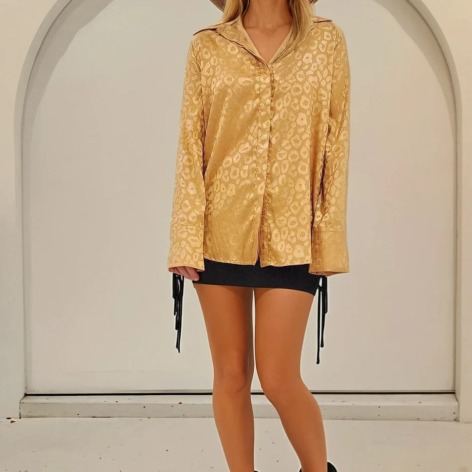 Front view of model wearing the ACOA animal print button up shirt.