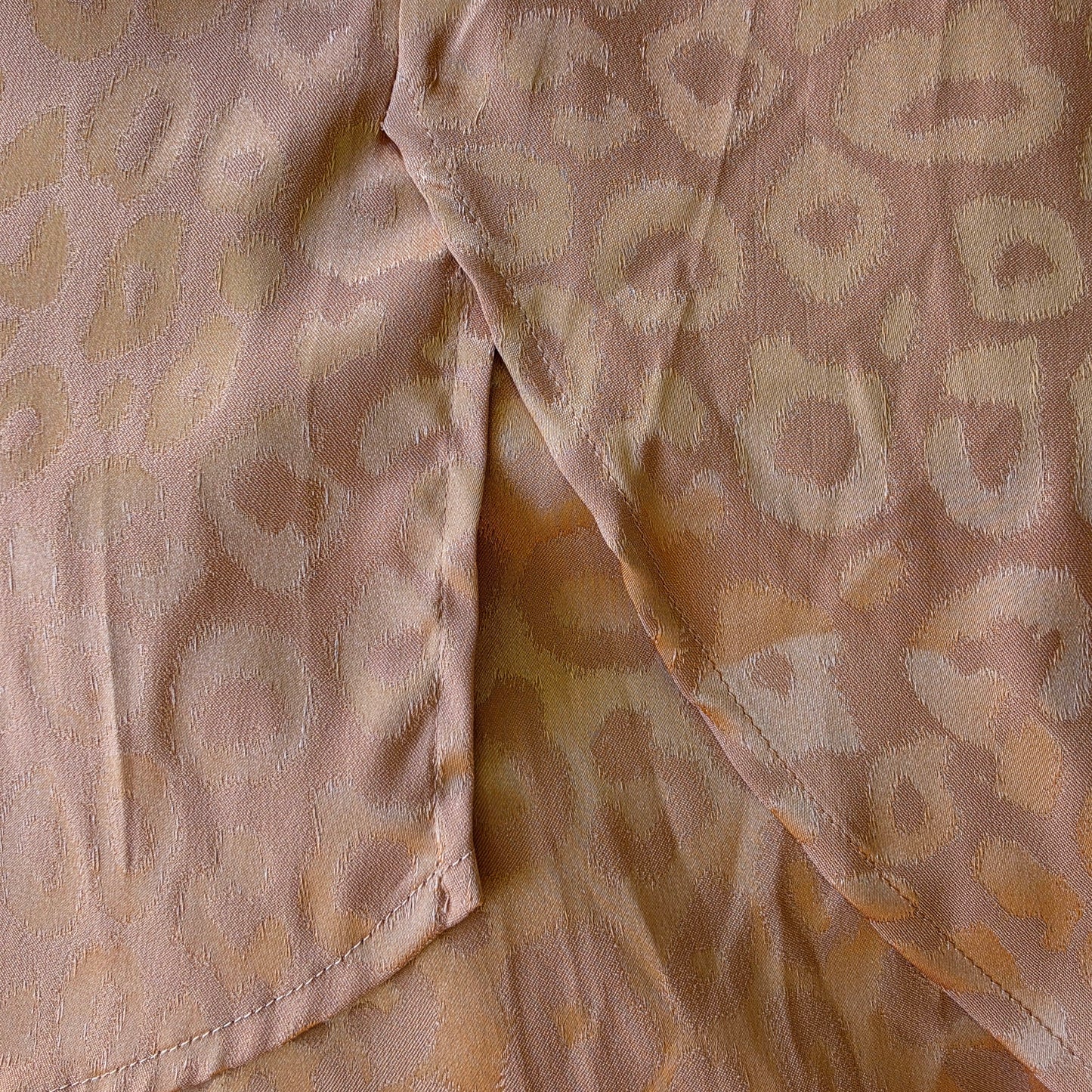 Close-up view of the side splits on the ACOA button up shirt