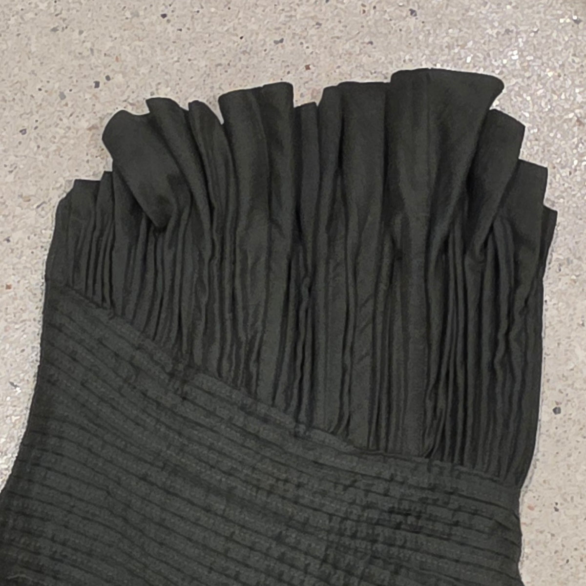 Close up image showing the pleated bust on the Aje Aquiline Gown