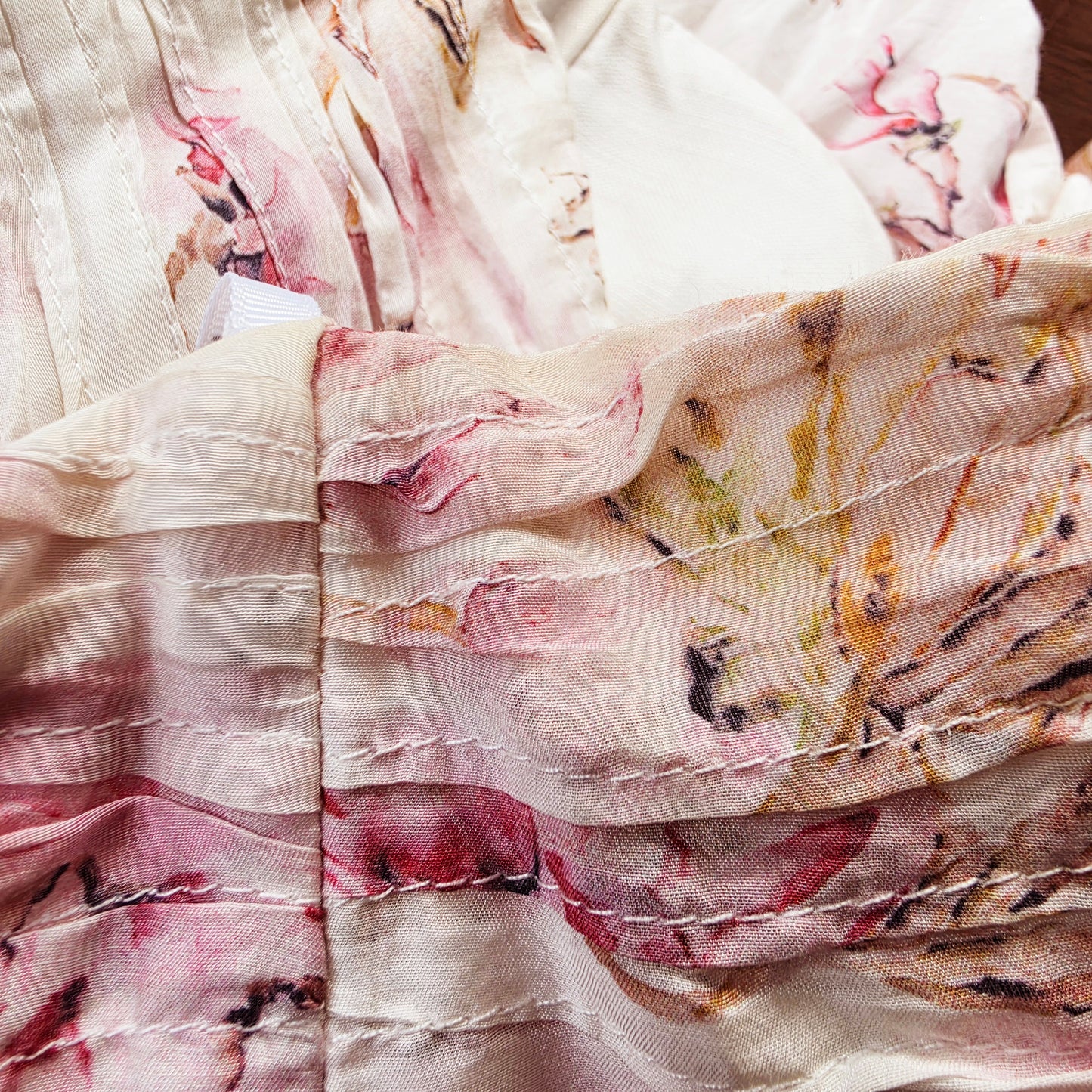 Image of the underarm area of the Aje floral dress showing the discolouration of the fabric