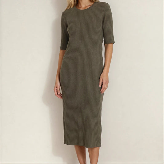 Front view of a woman wearing a green ribbed Assembly Label midi dress