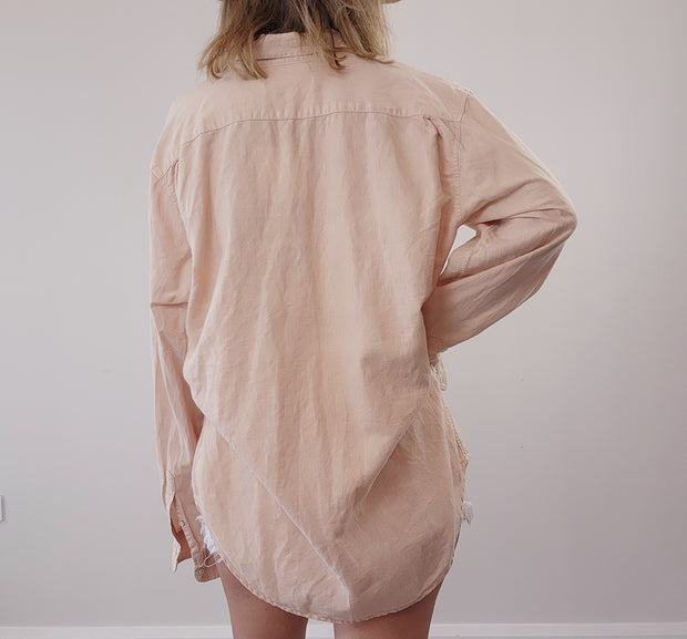 Back of Assembly Label long sleeve, button up shirt for males or females. Second-hand shirt.