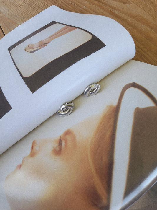 Image of the vintage Barcs clip on earrings, showing the petite style and sculptural design