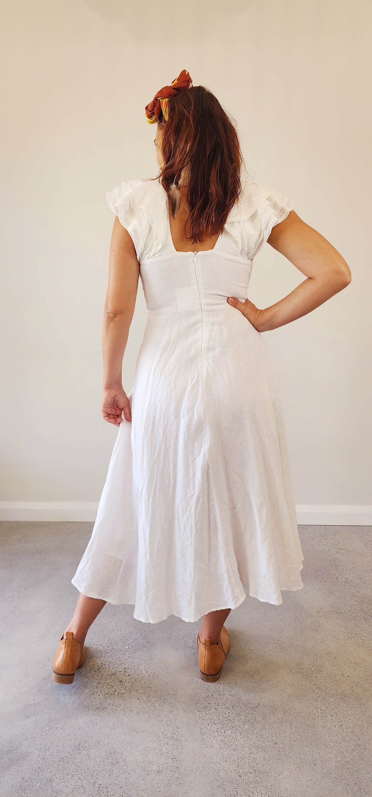 Back view of the Lafontelina dress, featuring a low square back and subtle zipper closure.
