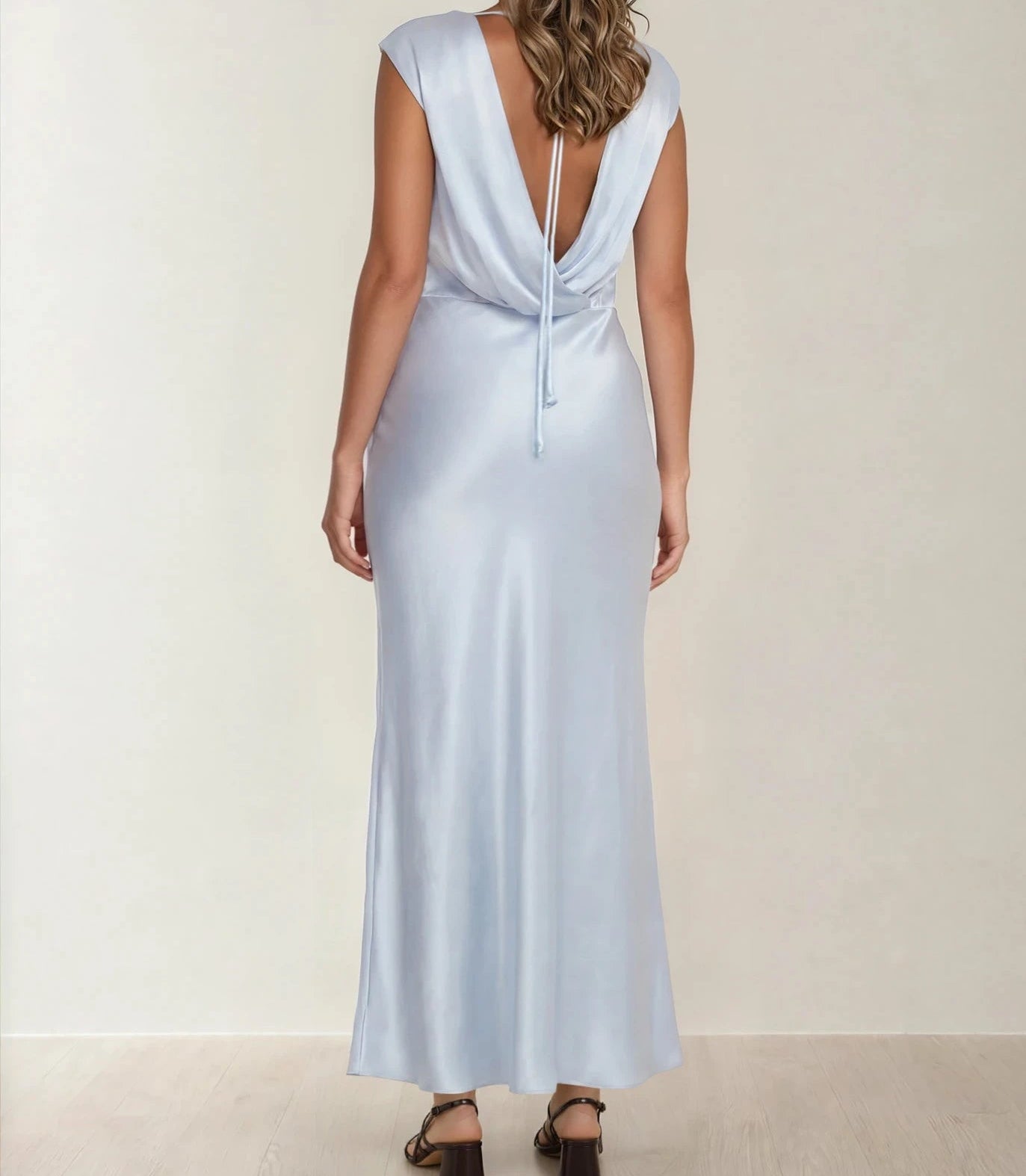 Back view of the Bec & Bridge Moon Dance Dress in soft blue, showing the soft drape and tie neck.