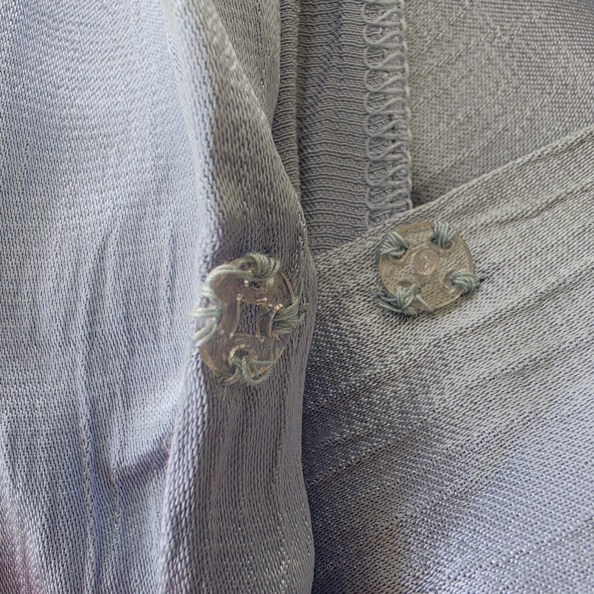 Image showing the snap button closure on the Bec & Bridge Moon Dance Dress in ice blue.