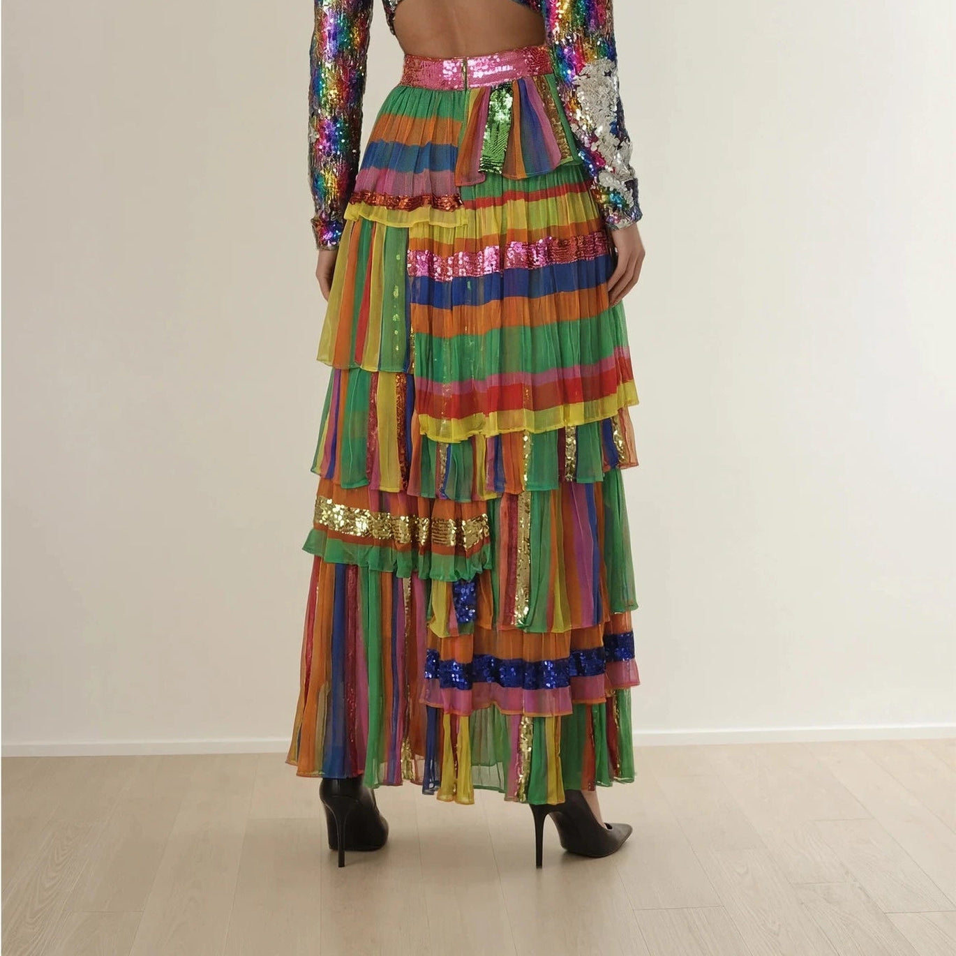 Model wearind the Bonita Collective The Viviana sequin skirt, showing the cascading sequins and tiered layers on the back of the skirt.
