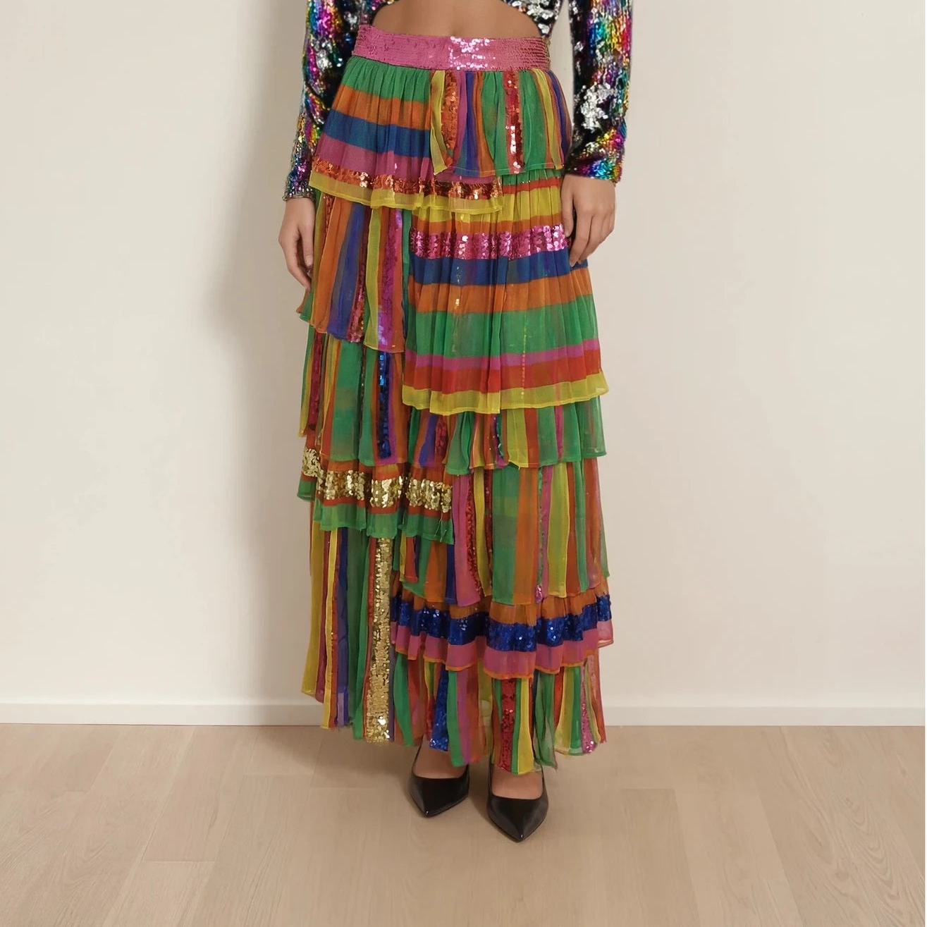 Model wearing the Bonita Collective, The Viviana sequin skirt, showing the colourful layers and sequins.