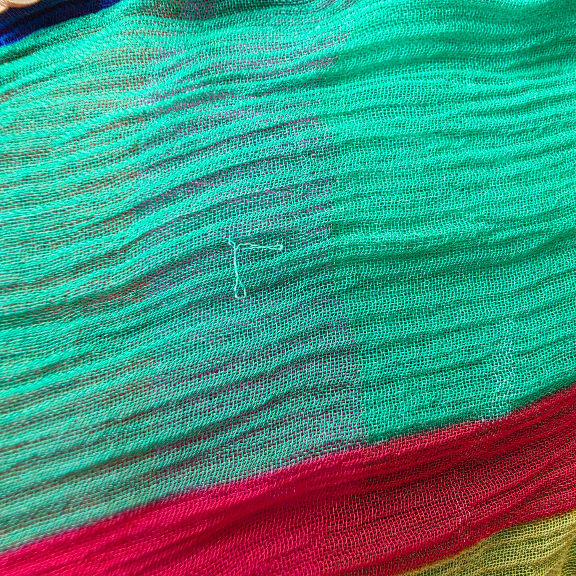 Close-up of green fabric section with visible pull on Bonita Collective Viviana skirt