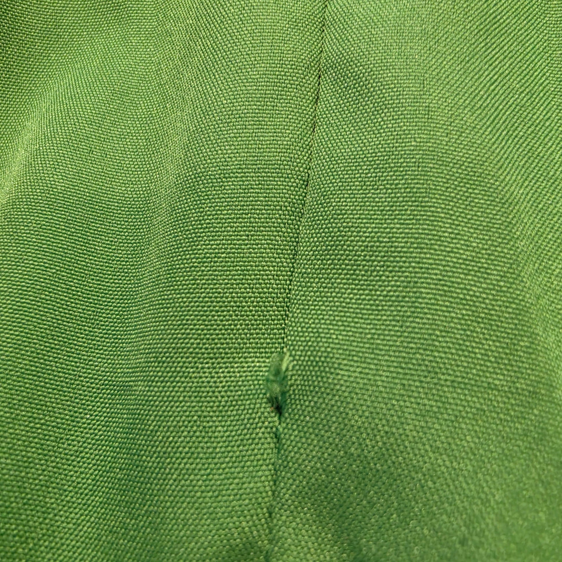 Close-up of green fabric section with visible pull on Bonita Collective Viviana skirt