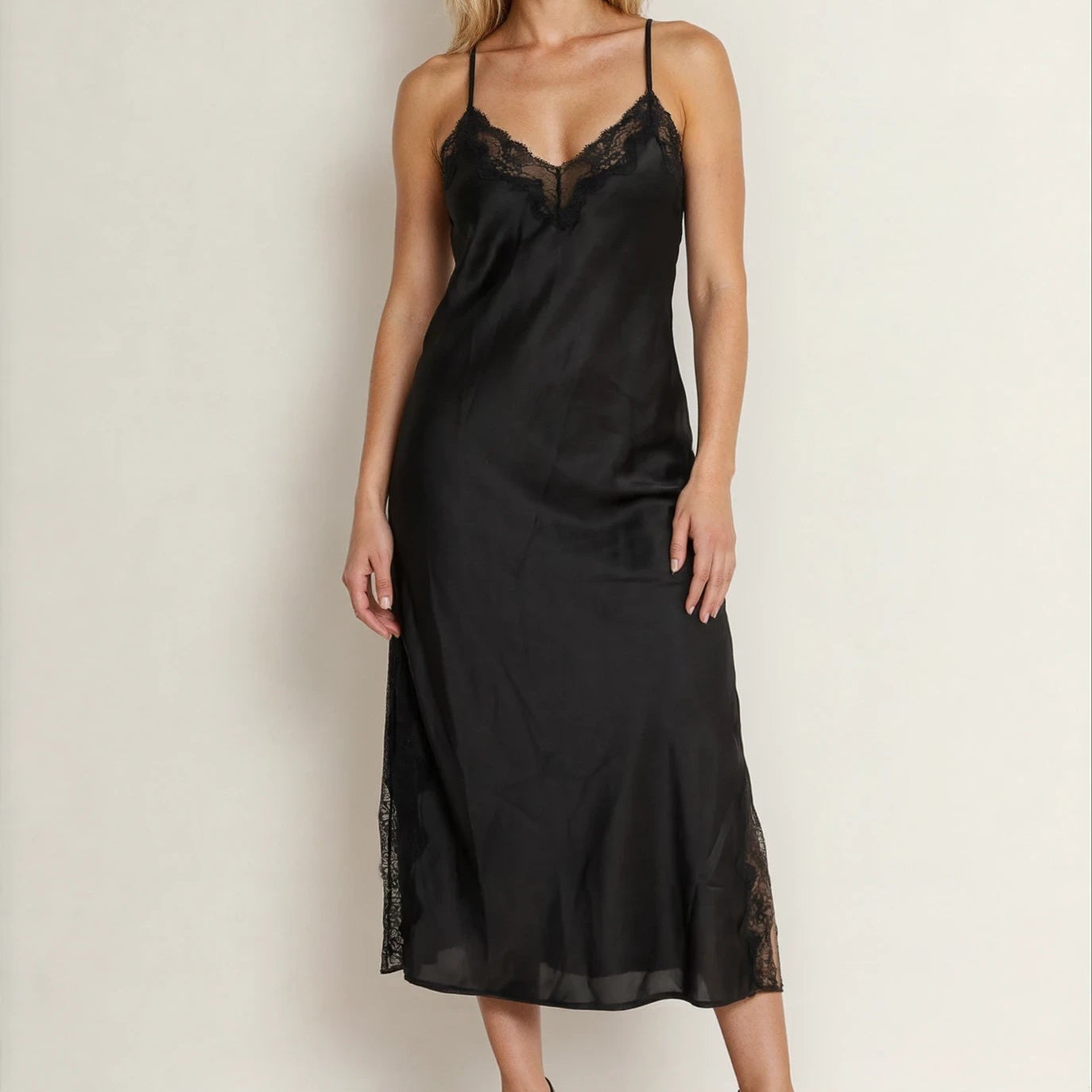 Front view of model wearing the Bras n Things midi slip dress, showing the v front and lace panels at neckline and along leg splits.