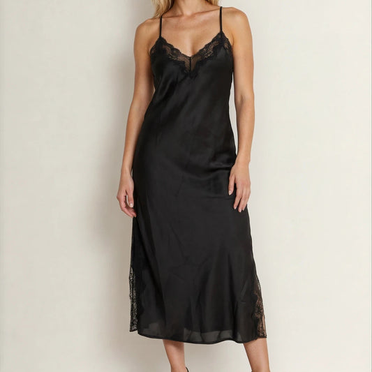 Front view of model wearing the Bras n Things midi slip dress, showing the v front and lace panels at neckline and along leg splits.