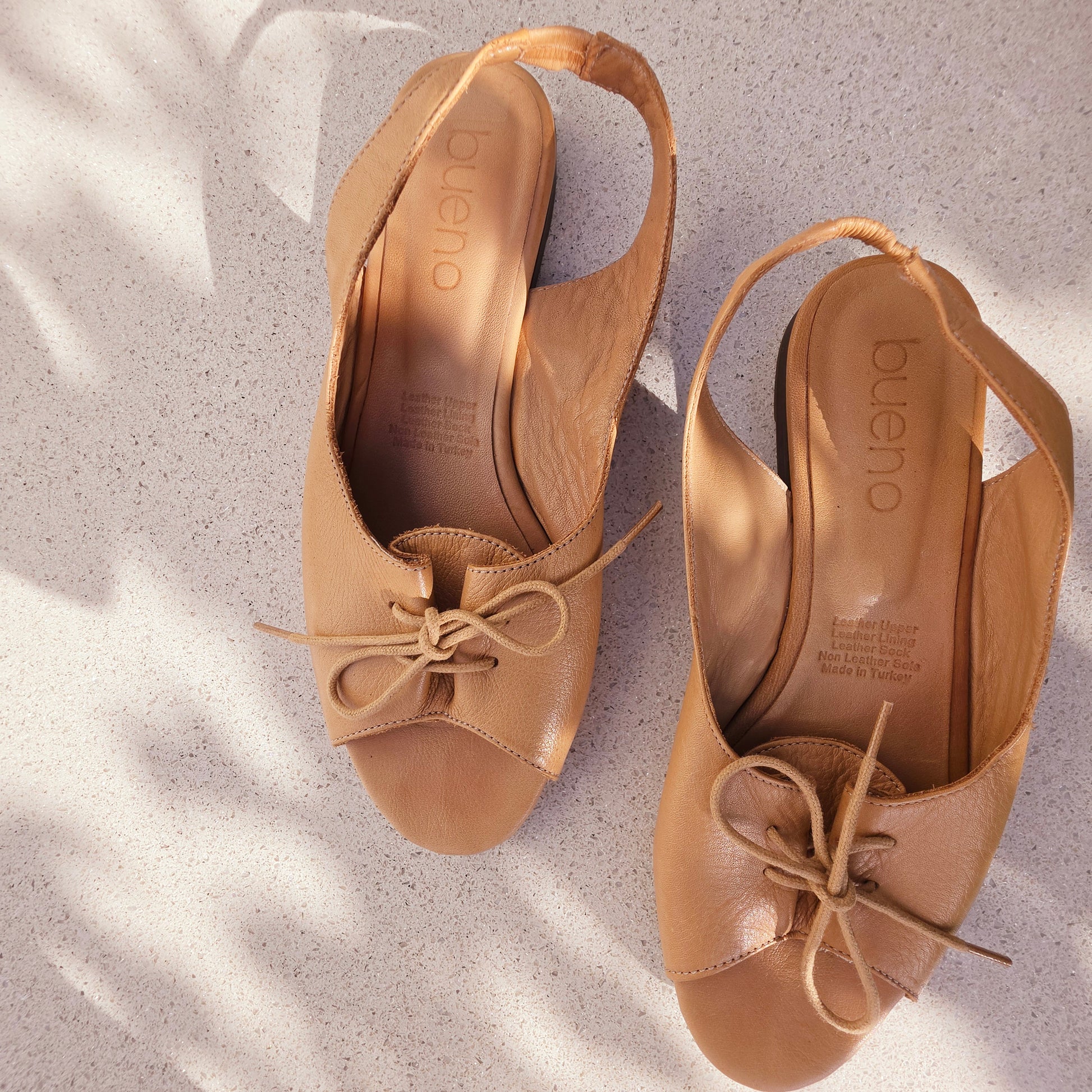 Bueno leather slingback sandals showing the lace up style and sling back