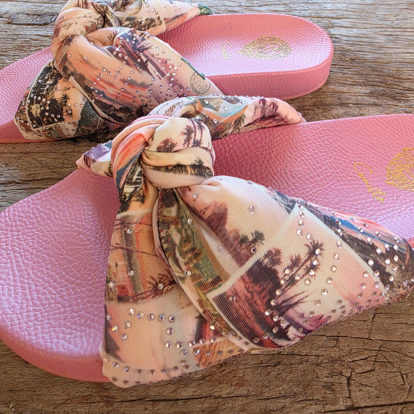 Camilla pink knotted slides side profile showing soft base and statement strap