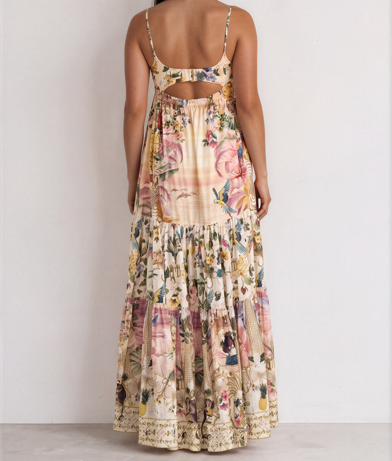 Back view of the CAMILLA x The White Lotus long dress with fitted jersey bodice, and clip back closure