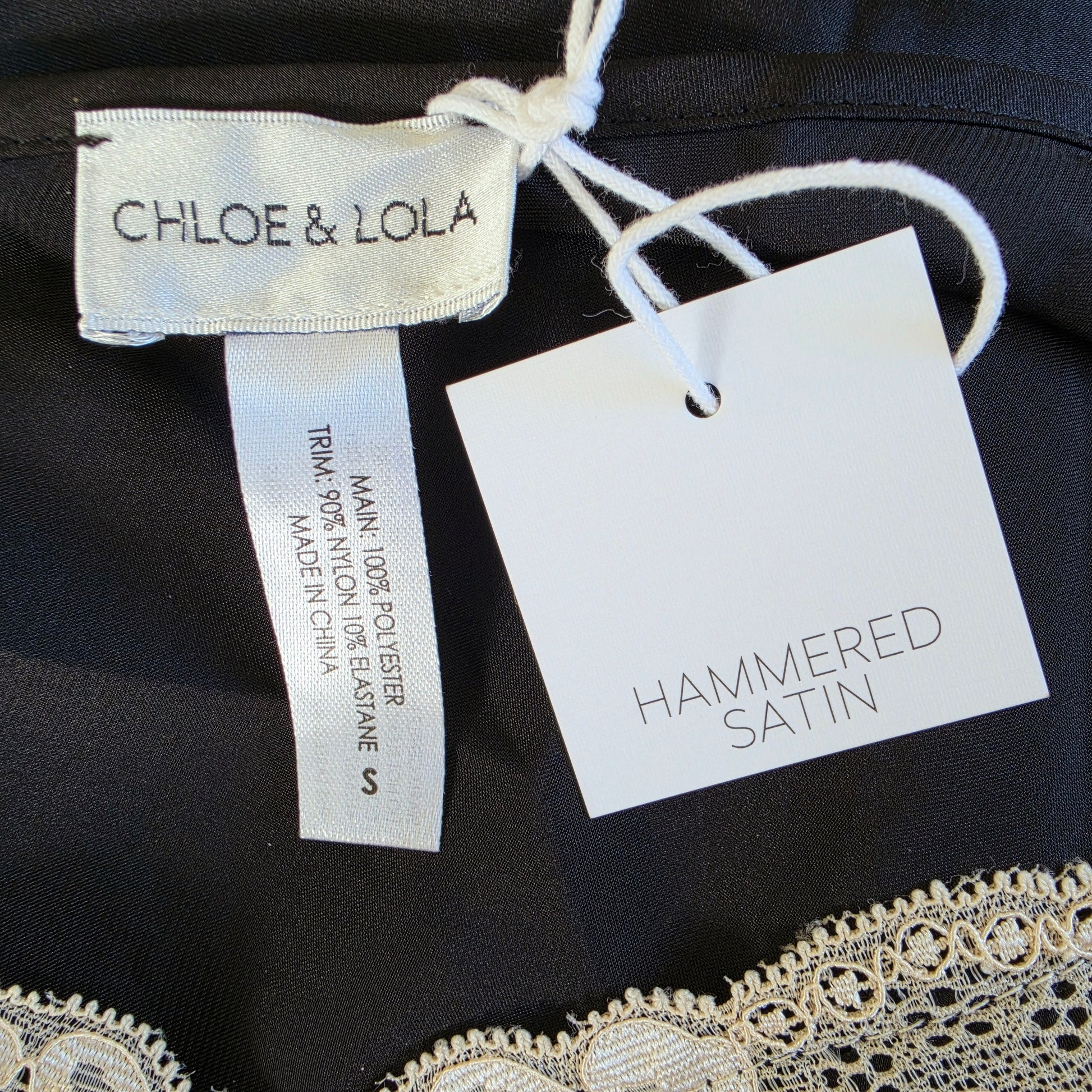 Image showing the Chloe & Lola label on the lace midi, slip dress.