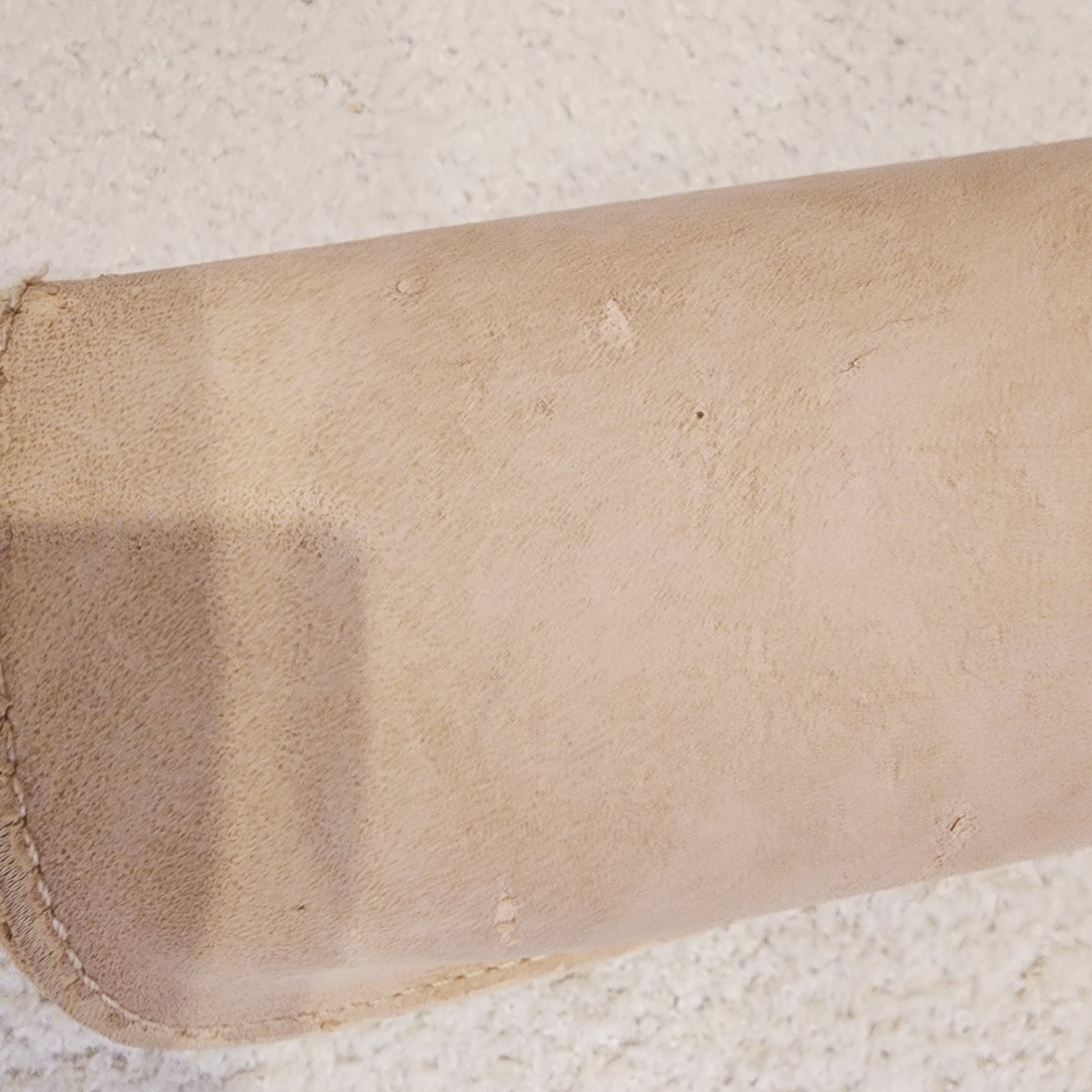 Back view of the chloe sunglasses case showing the peeling fabric