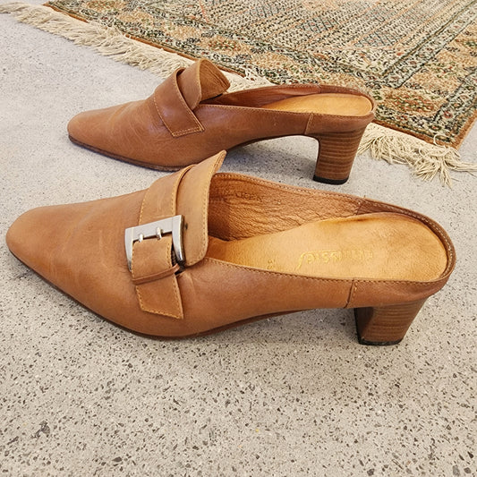 Side view of Chrissie tan leather buckle mules in size 38, showing the block heel and smooth leather finish.