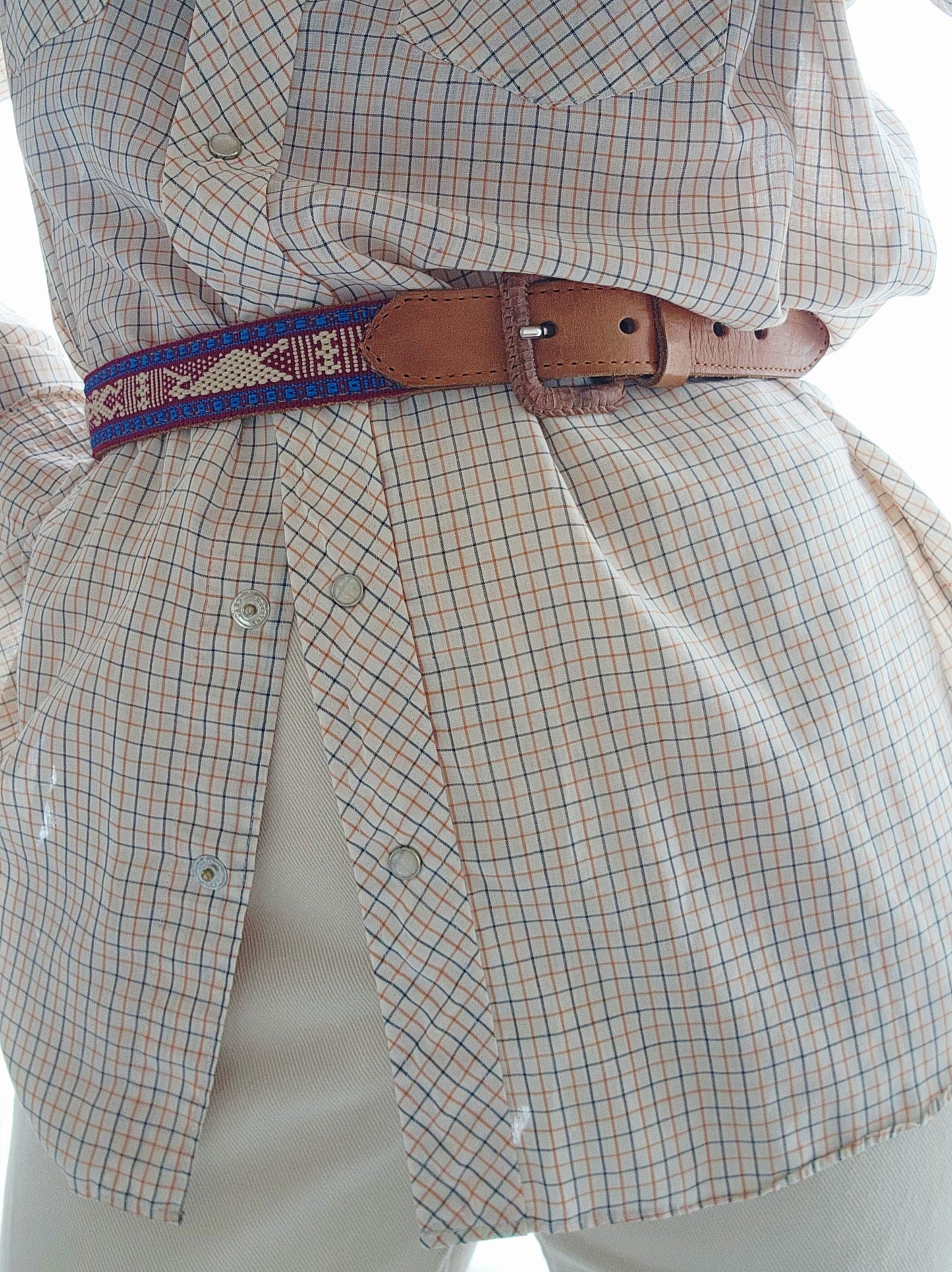 Cielo Collective handwoven belt styled over a checked shirt dress, highlighting western-inspired look.