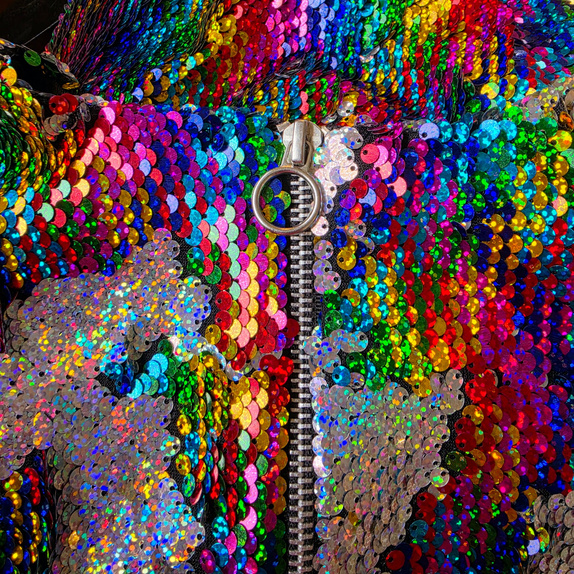Multicolour sequin bodysuit with exposed silver zip closure and circular pull detail