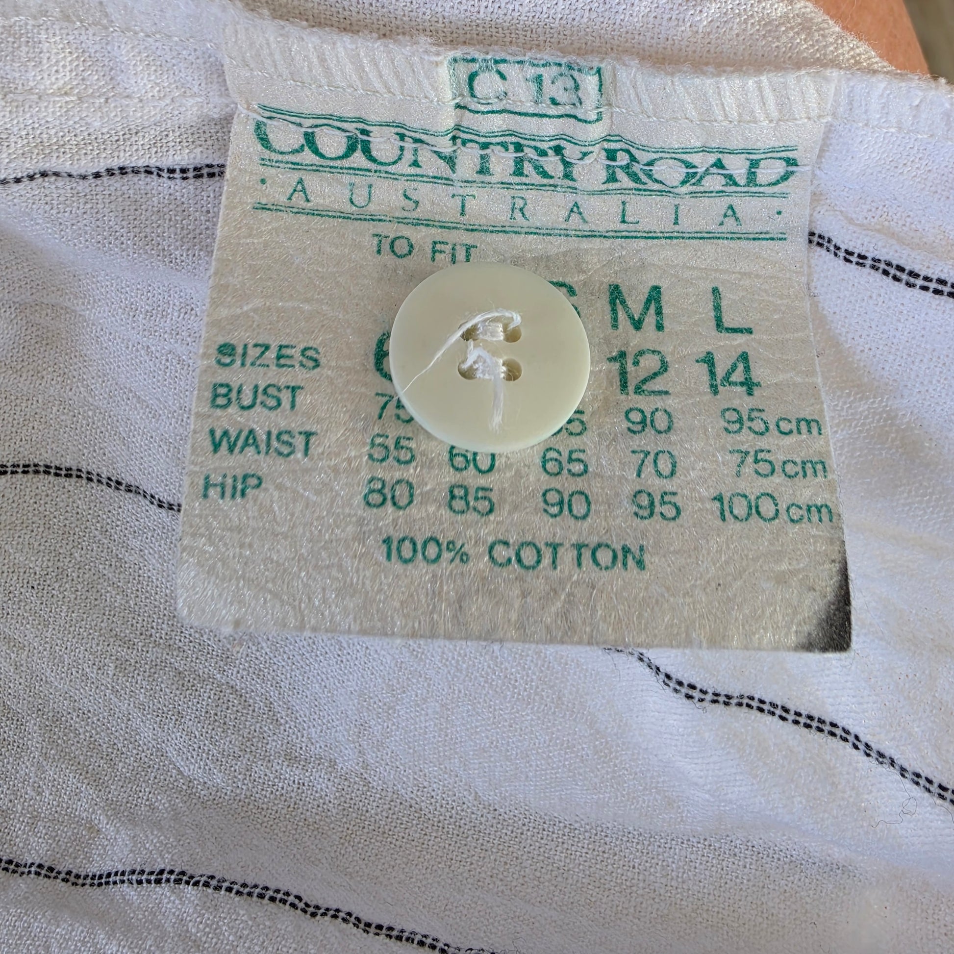 Vintage Country Road Australia label with green print and sizing chart, circa 1990
