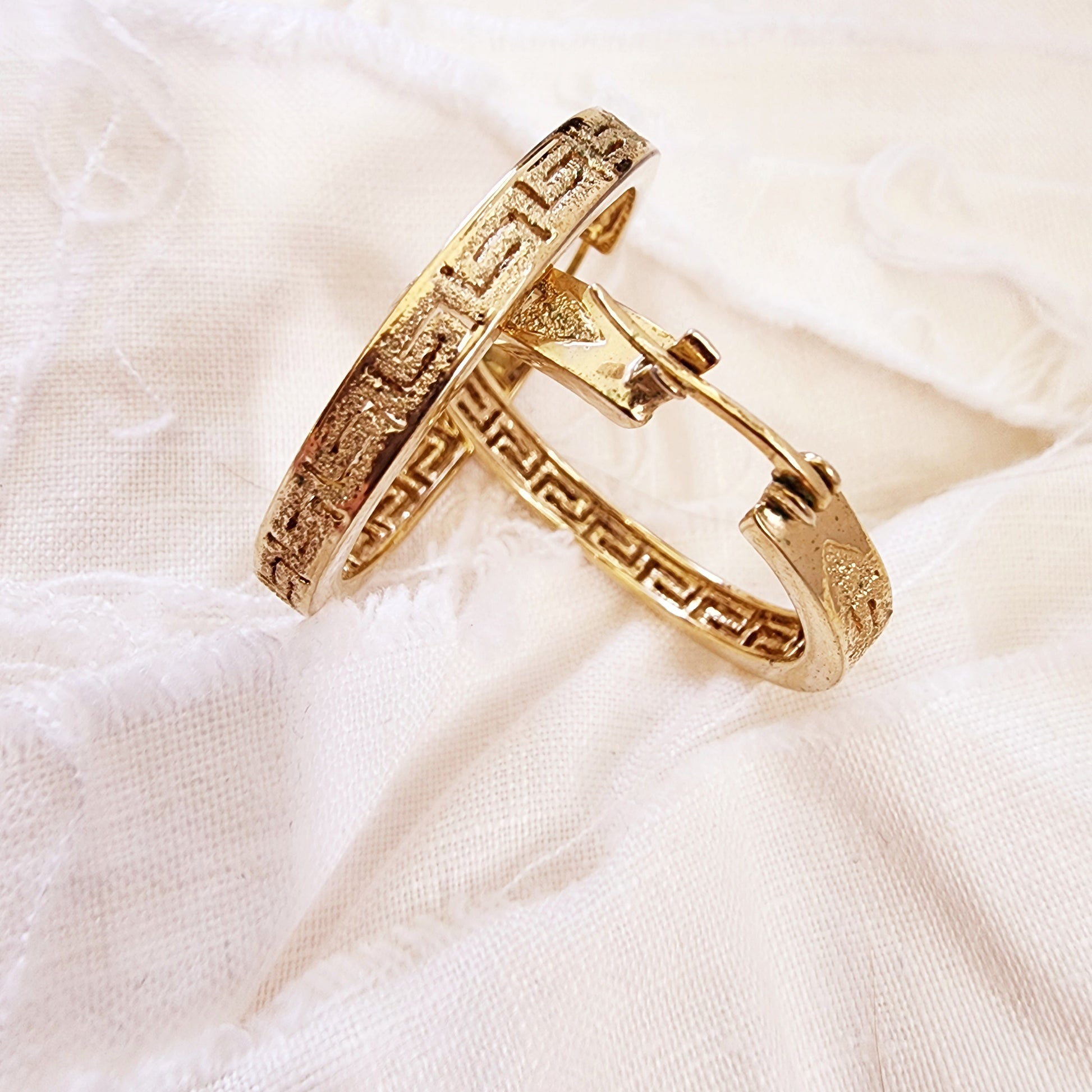 Close-up of the Desert at Dusk hoops highlighting the textured border and dusk-inspired gold sheen.