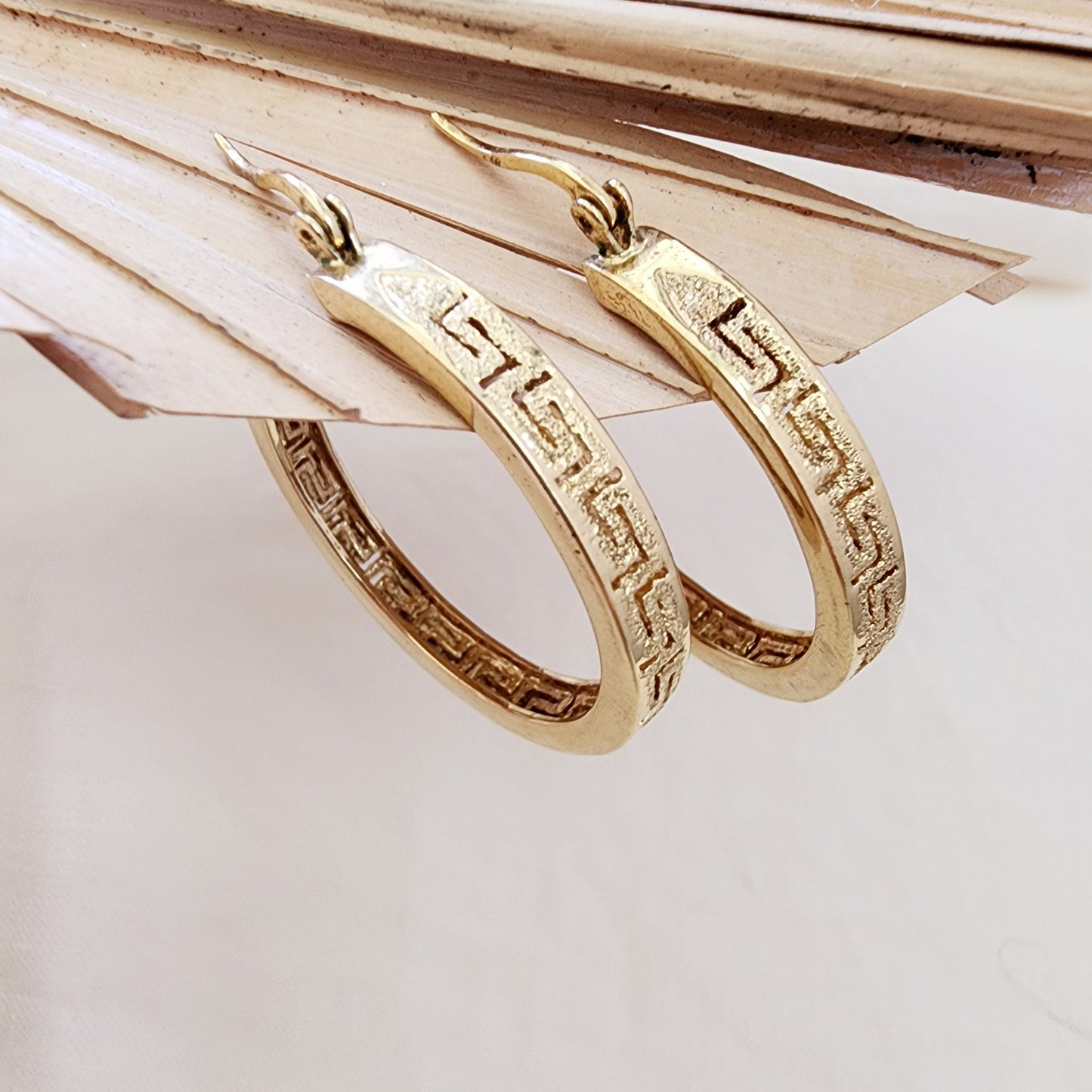 Front view of the Desert at Dusk hoops showing the etched pattern and warm gold-tone finish.