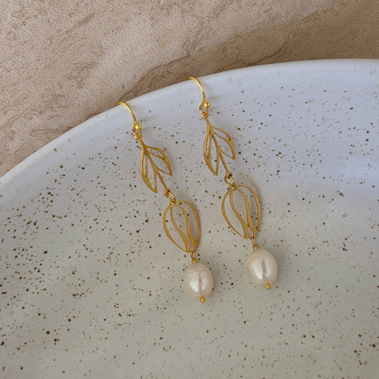 Top view of the Dew handmade pearl earrings showing the bright sheen and uniquely shaped pearls