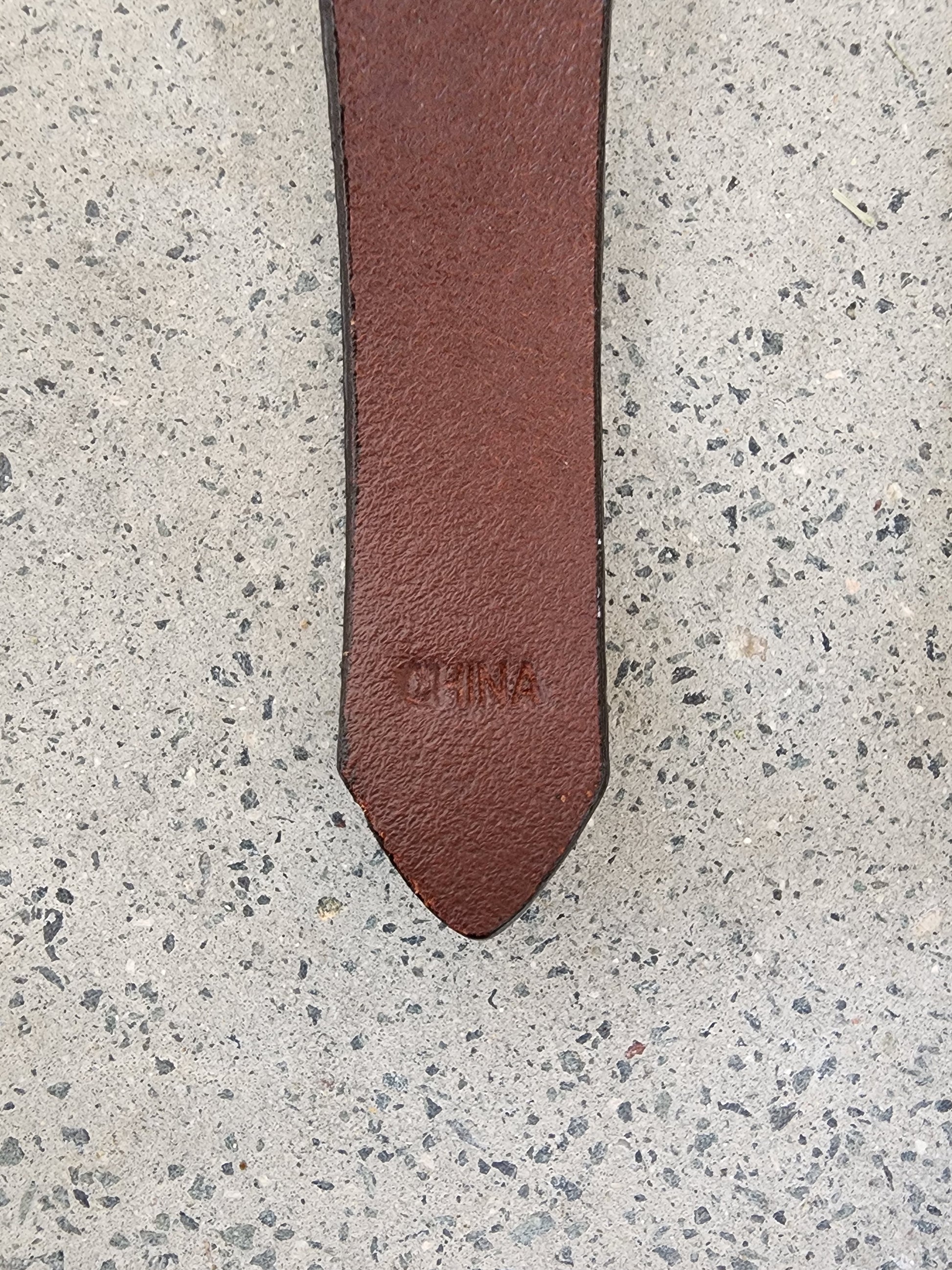 Close up of the country of origin stamp on the Dockers leather belt.