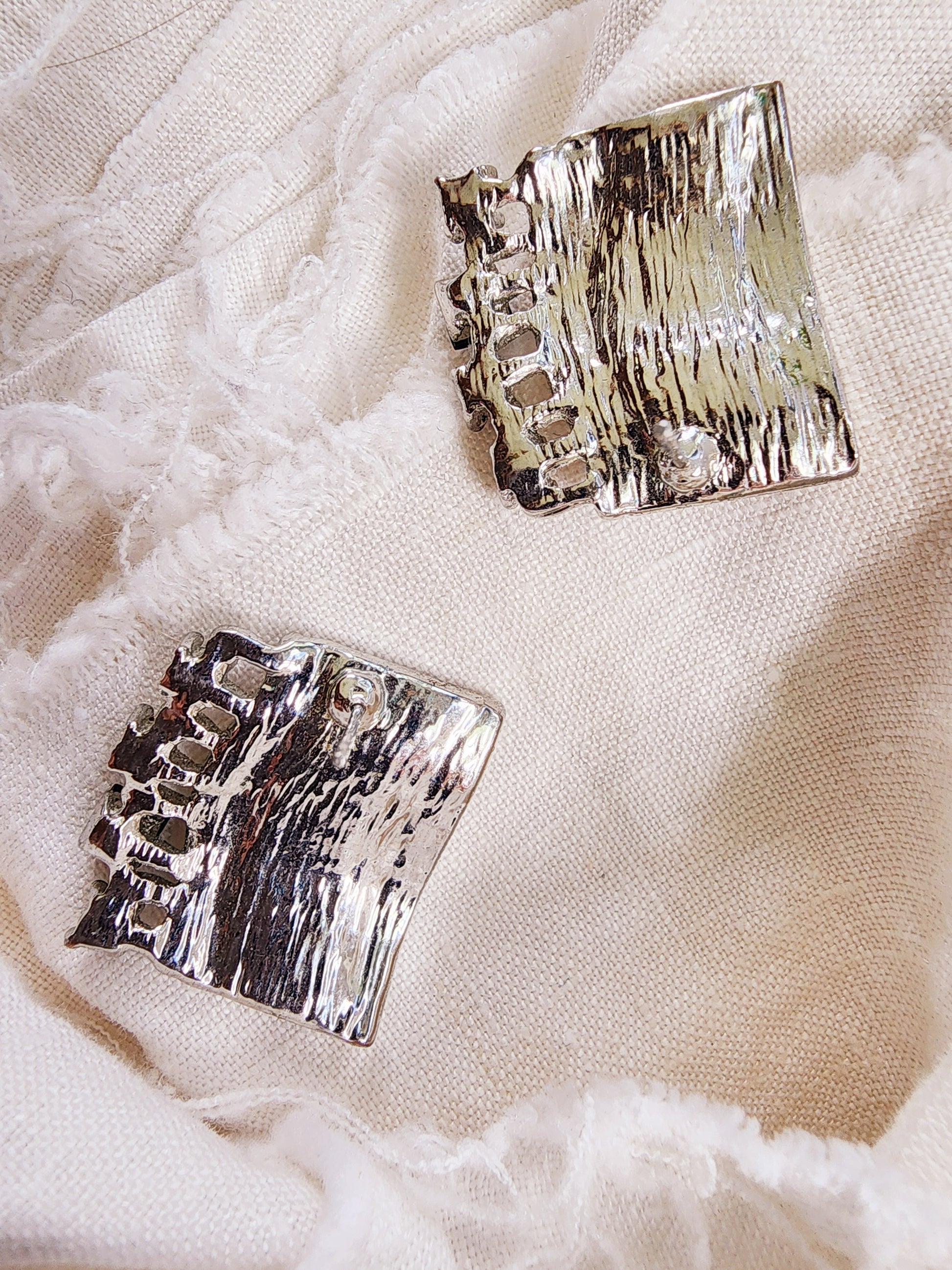 Back of Drift earrings showing silver-tone surface