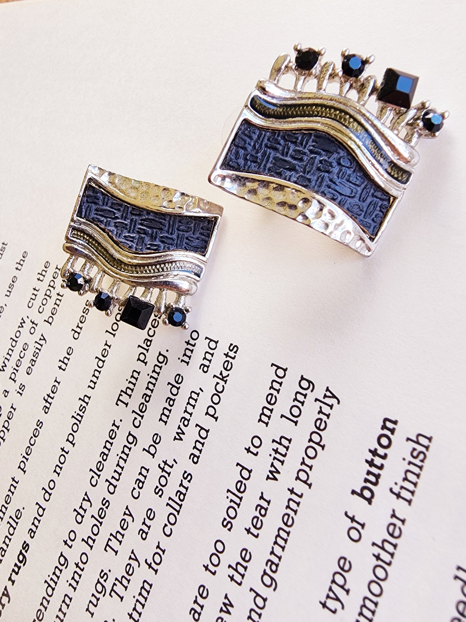 Close-up of navy fabric panel and dark stone detailing