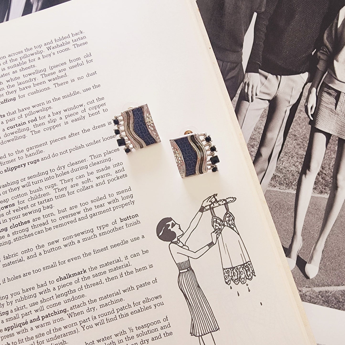 Square silver-tone Drift earrings with navy textured panel, front view