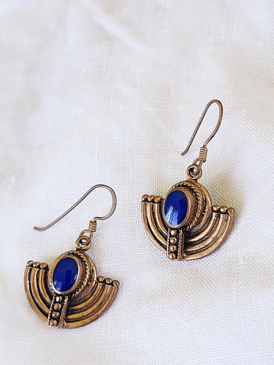Front view of the Dune Relic earrings showing the arched style with blue enamel detail.
