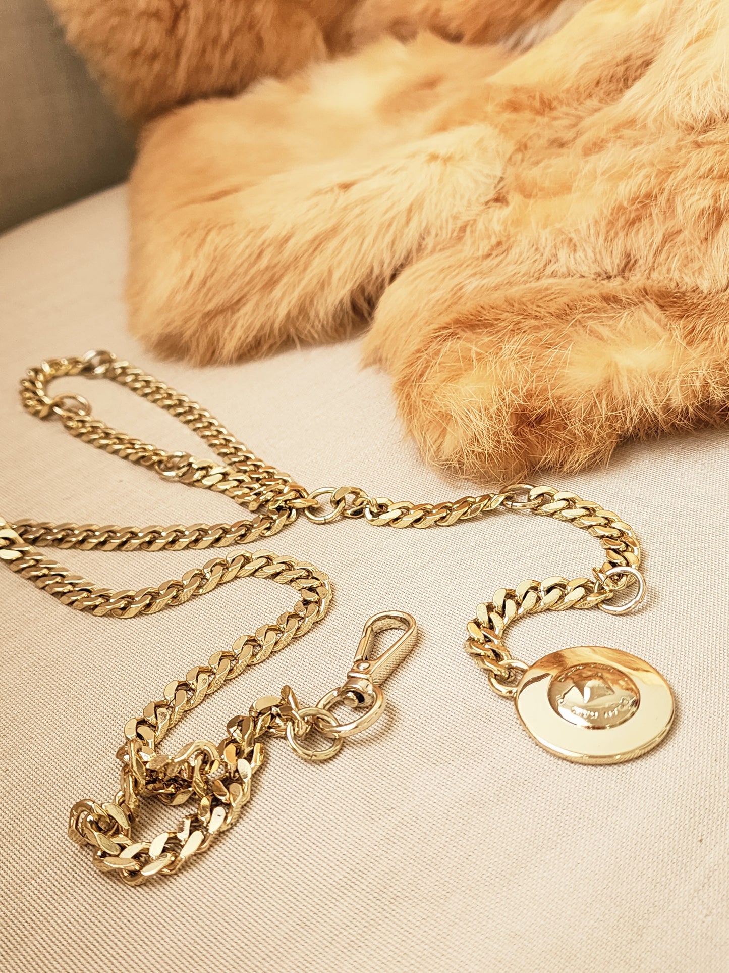 Dylan Kain 88 gold chain belt laid flat showing full length and hardware.