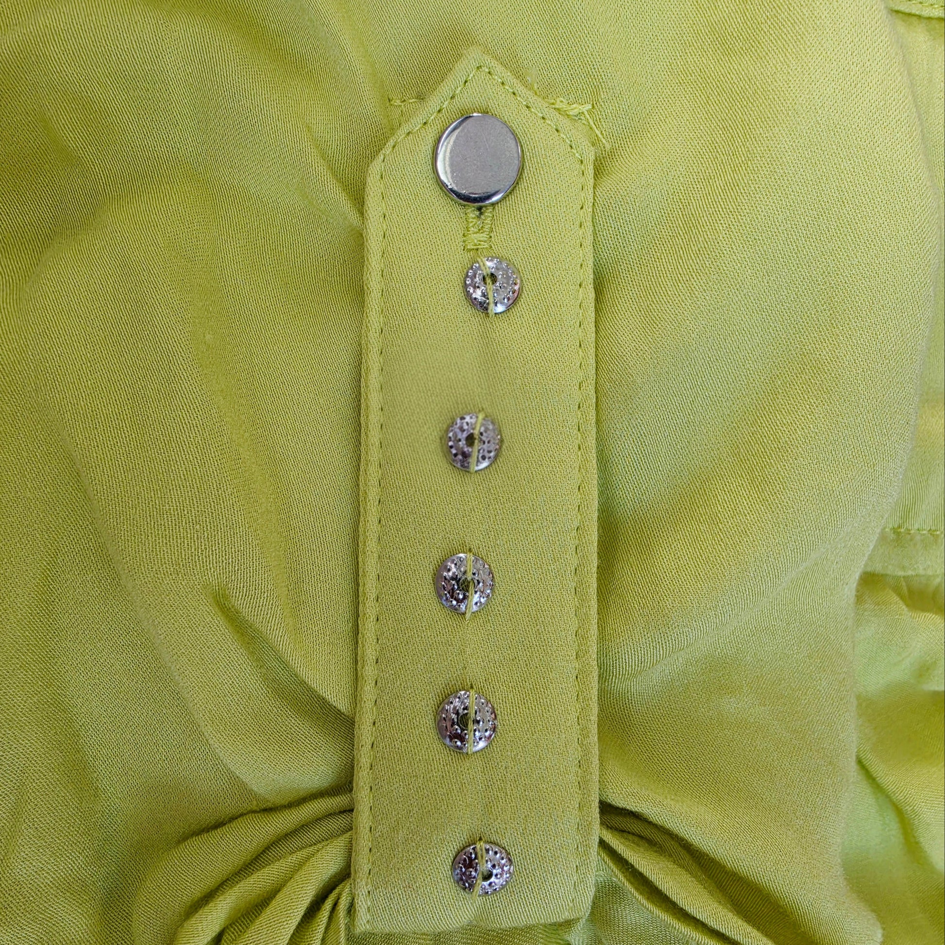 Close up view of the silver sleeve detail on the Eva Kayan